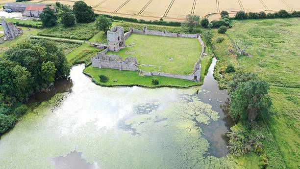 istock Aerial view of medieval castle ruin with moat. 2235734309