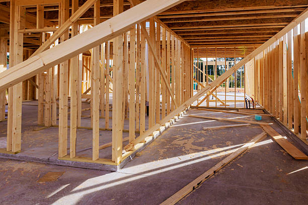 istock Construction site showing wooden framing for new house in progress during works daytime 2235735322