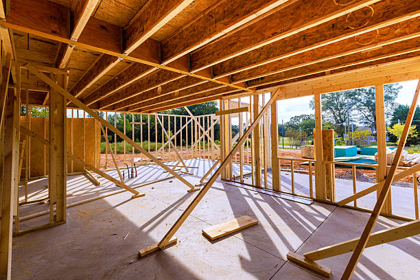 istock Construction site showcasing wooden framing support beams during daylight at residential building project 2235735323