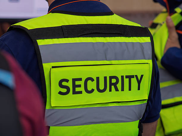 istock Security Personnel in High-Visibility Safety Vest at Event 2235737540