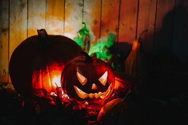 istock Glowing Jack-o'-Lanterns with Smoke for Halloween 2235737771
