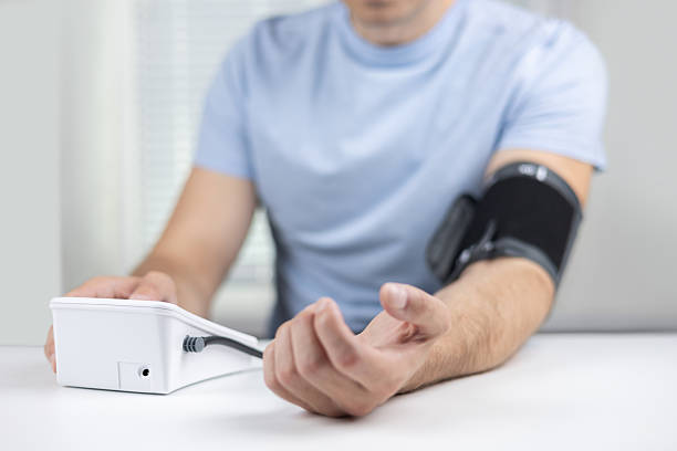 istock Closeup of unrecognizable male patient using modern tonometer at home 2235737987