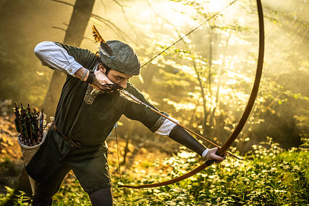 Indigenous person from the Wassú tribe using a bow and arrow in the forest