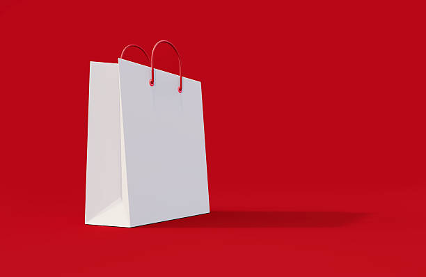 White shopping bag on red background. Shopping concept.