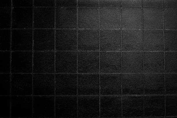 istock Black stone background with imitation tiles. Top view. Free space for text or design. 2235741693