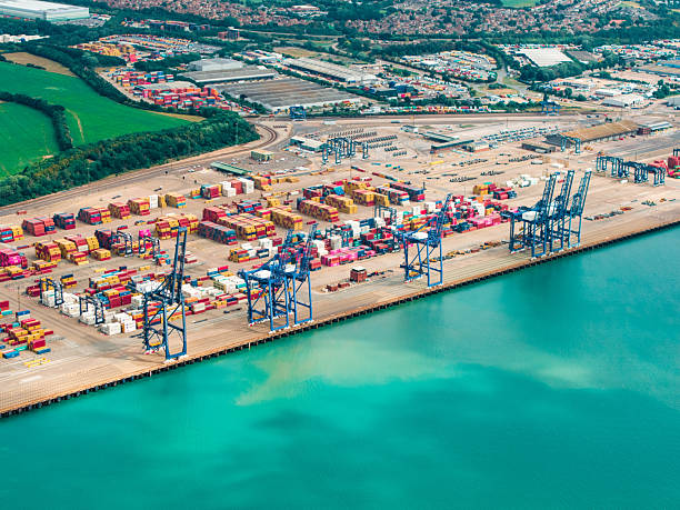istock Cranes loading cargo containers at felixstowe port, england 2235742933