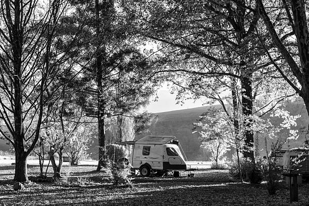 Mountain Splendour, South Africa - May 14, 2025: Camping at Mountain Splendour Eco-Resort near Winterton. A caravan is visible. Monochrome