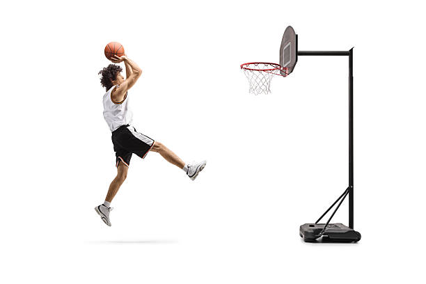 istock Basketball player jumping and shooting a ball 2235744639