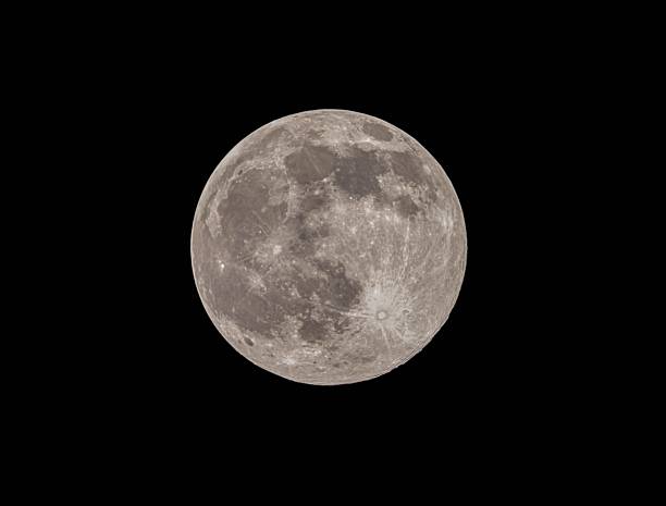 A detailed full moon against a black night sky, showcasing lunar surface features.
