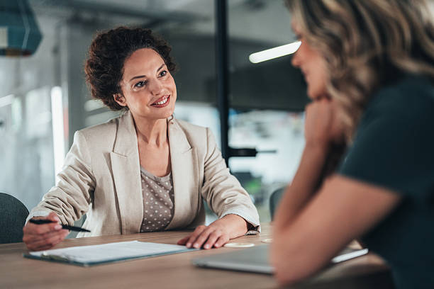 istock Professional discussion between advisor and client and successful signing of contract 2235745534