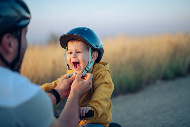 istock Safety first during bike riding lessons with dad. 2235748095