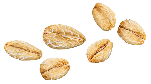 istock Flying Oat flakes heap isolated on white background. .Levitating Rolled oat flakes Top view. Flat lay 2235748461