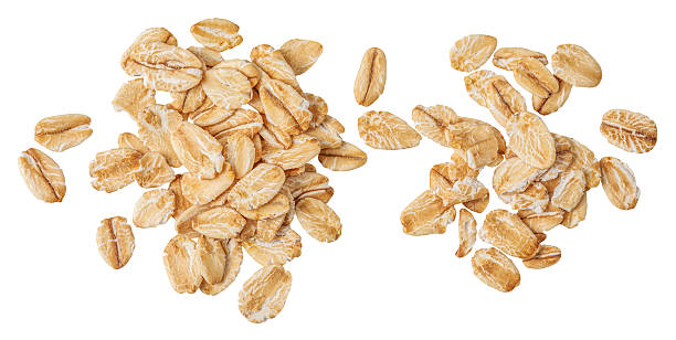 istock Oat flakes heap isolated on white background. .Rolled oat flakes Top view. Flat lay 2235748546