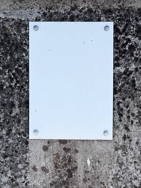 istock Plaque with place for text on granite gray brown wall 2235748709