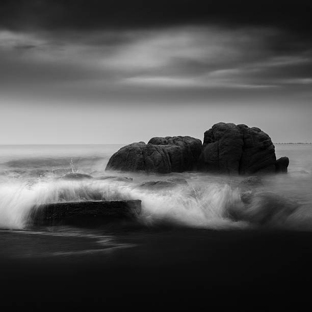 istock Black and White Coastal Scene: Waves and Rocks 2235750276