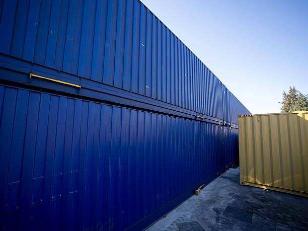 istock Stack of shipping containers in a port or warehouse 2235750993