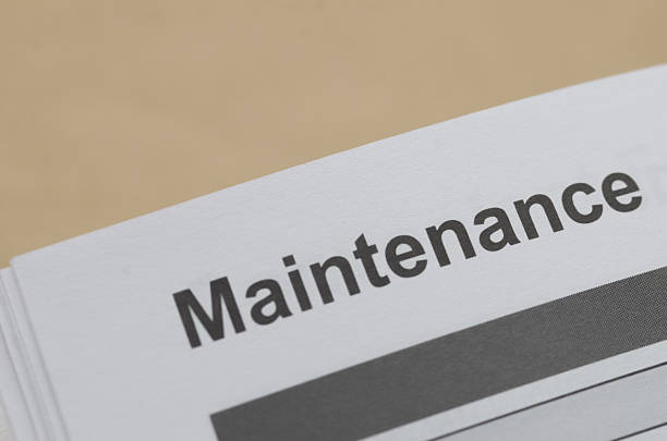 istock the title Maintenance on a white page, representing the essential process of service, inspection, and equipment care in a corporate setting. 2235751068