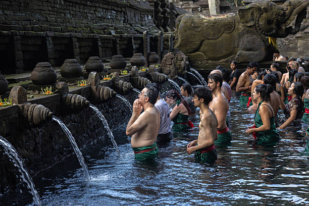 People in Bali were praying and purifying themselves Tirta Empul temple in Indonesia.