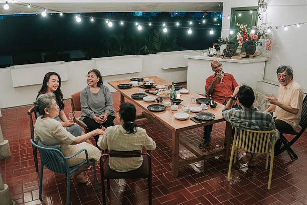 istock Multicultural asian family gathering enjoying dinner and conversation at home 2235752693