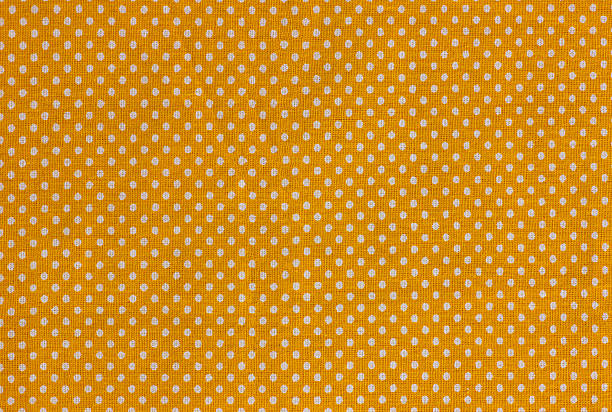 istock White polka dots over dark orange background 2235755634
