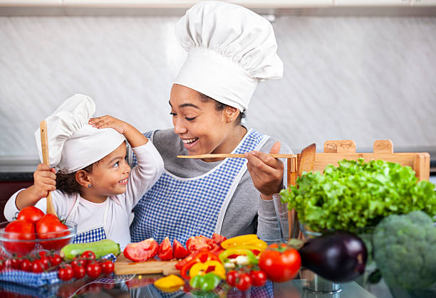 istock Happy family in the kitchen. 2235759138