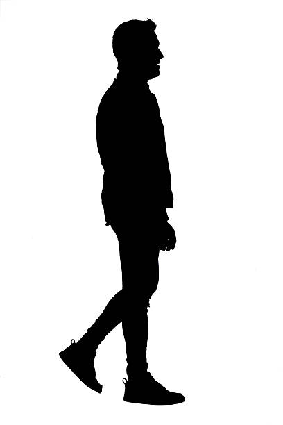 istock silhouette of a side view of cool man walking 2235759714