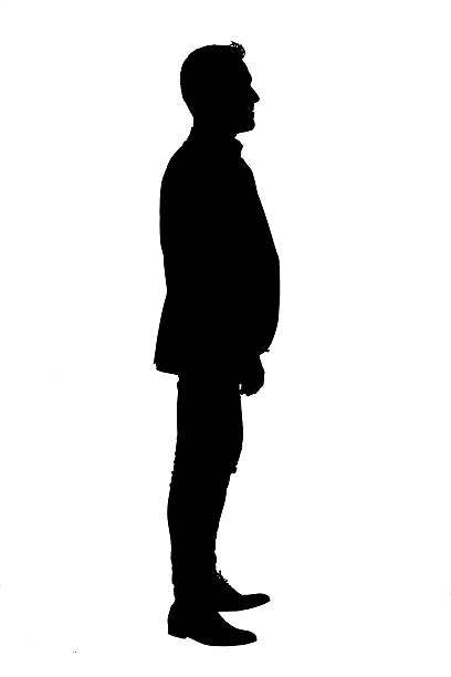 istock silhouette of a side view of a cool man standing 2235759715