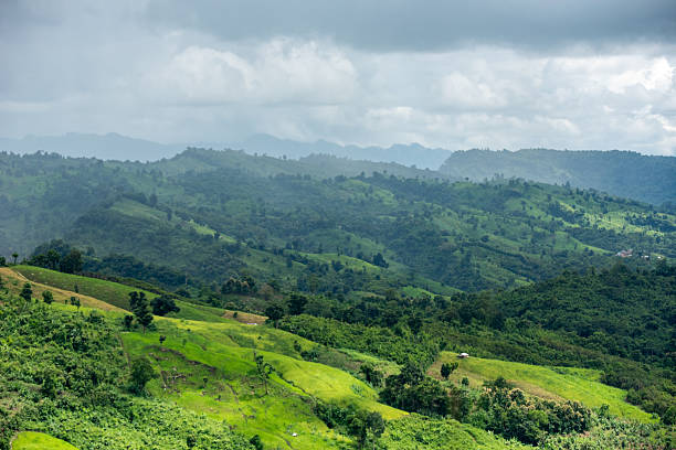istock Rolling hills under a dramatic cloudy sky. Toma Tungi is a tourist complex and viewpoint in Thanchi, Bandarban, Bangladesh. Overcast Mountain Landscape A Lush Green Terrain Under a Cloudy Sky. 2235762610