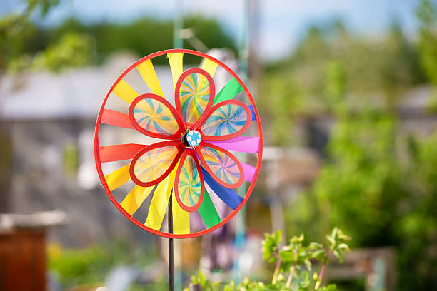 Close-up image of beautiful colorful paper windmills used for home decoration.