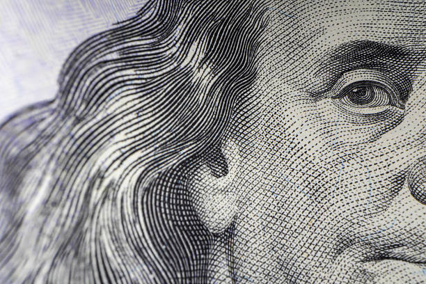 istock Macro Shot of Franklin's Eyes on 100 Dollar Bill 2235765567
