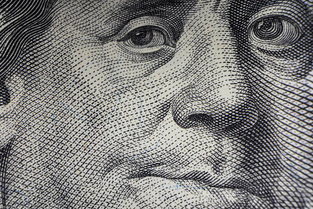 istock Macro Shot of Franklin's Eyes on 100 Dollar Bill 2235765571