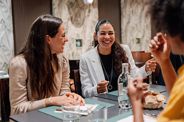 istock Cheerful group of youn business creative in a fine dining restaurant 2235766929