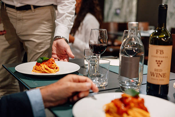 istock Vegan spaghetti with tomato sauce and fresh basil served in a restaurant 2235767116