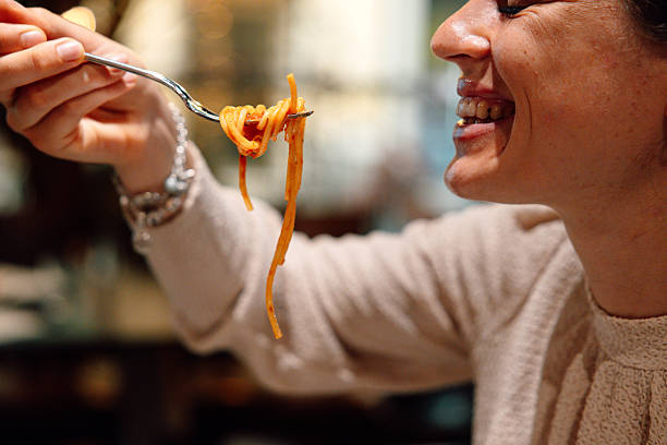 Typical italian pasta plate, spaghetti with tomato sauce and fresh basil.