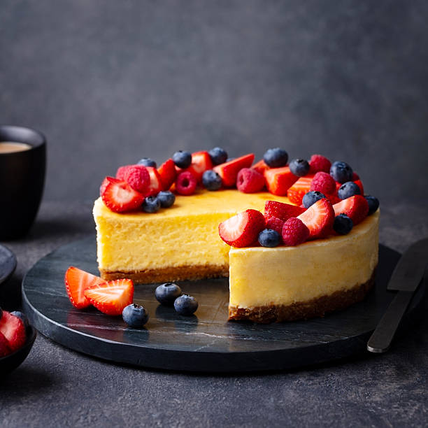 istock Cheesecake cake with fresh berries. Dark background. Close up. 2235769482
