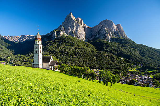 istock view on Saint Valentin church and Dolomites in Kastelruth, Italy 2235770785
