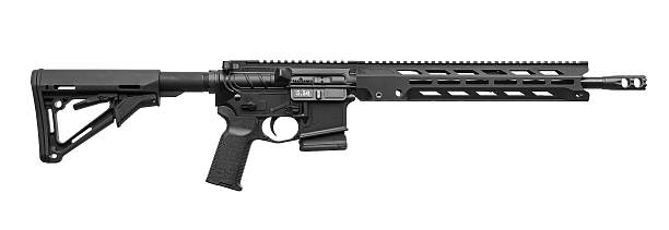 istock A black tactical carbine rifle with an adjustable stock and a handguard. 2235771064