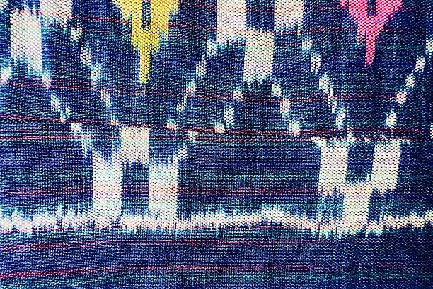istock Handwoven ikat textile featuring colorful geometric patterns. Perfect for backgrounds, fashion, interior design, and cultural themes. 2235772883