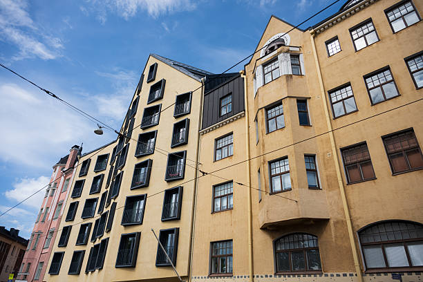 istock Tall colorful apartment buildings against blue sky.. 2235773320