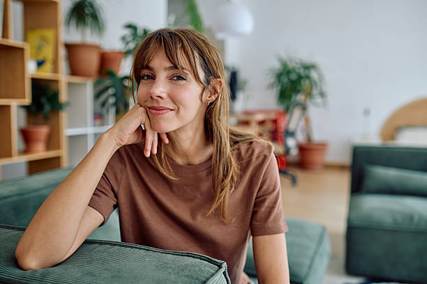istock Woman relaxing on sofa at home enjoying quiet moment 2235775469