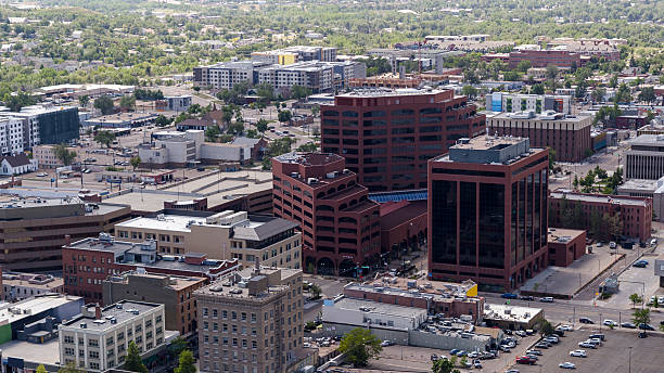 istock Commercial district cityscape with red brick office buildings and mixed-use development seen from an aerial view in downtown Colorado Springs, Colorado, USA. 2235775931