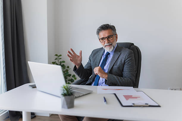 istock Senior businessman having a video call in his office 2235775942
