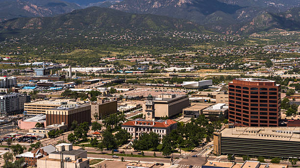 istock Foothills frame urban development in Colorado Springs, Colorado. Commercial district with historic courthouse surrounded by modern office buildings against mountain backdrop. 2235776987