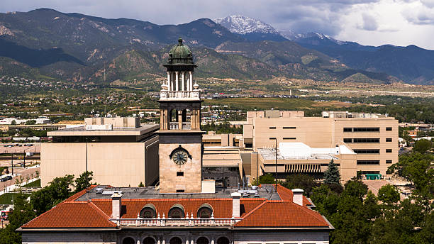 istock El Paso County Courthouse with iconic clock tower against mountain backdrop. Government district in Colorado Springs with snow-capped peaks. 2235777052