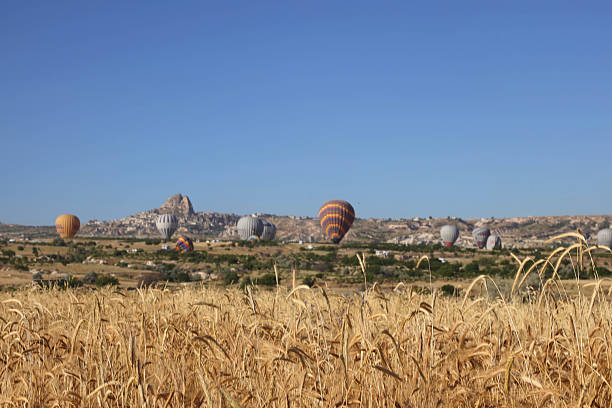 Cappadocia, located in Türkiye's Central Anatolia Region, is a fascinating region renowned worldwide for its unique natural formations and historical riches. Millions of years ago, soft rock layers formed by lava erupting from Mount Erciyes, Hasandağı, and Göllüdağ were shaped by wind and rain, creating the extraordinary formations known today as fairy chimneys.The region was enriched with settlements such as Göreme, Ürgüp, Avanos, Uçhisar, Derinkuyu, and Ihlara, and throughout history, it has hosted numerous civilizations, from the Hittites and Romans to the Byzantines and Ottomans. Rock-cut houses, churches, and underground cities reveal both Cappadocia's architectural and cultural heritage.Today, Cappadocia is an indispensable destination for both domestic and international tourists, with its hot air balloon-viewed landscapes, cave hotels, valleys, and wine-producing tradition.