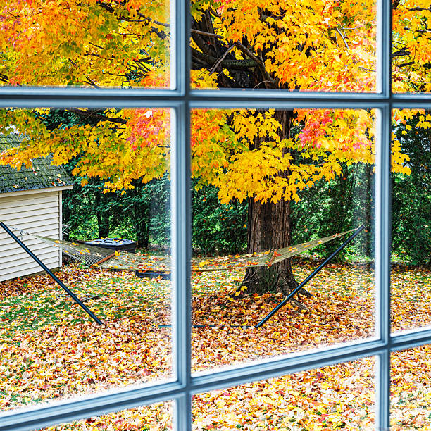 istock Lazy Hammock Covered in Autumn Colors Looking Through Bay Window 2235777643