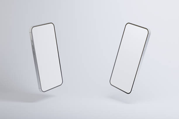 istock Two modern smartphones with blank white screens floating against a light background, minimalistic mockup concept for mobile apps, technology, digital design, and user interface. connection, concept 2235780180
