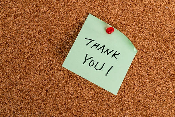 istock Thank you message on sticker note pin on cork wall 2235784969