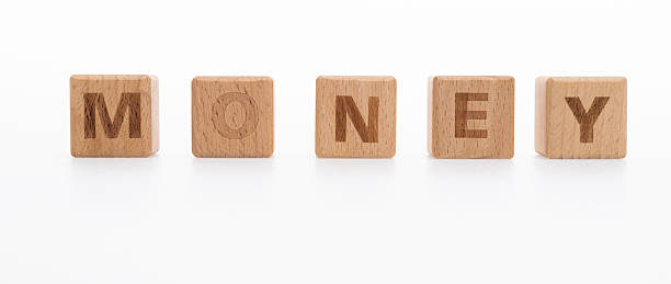 istock Wooden blocks with word money 2235785666