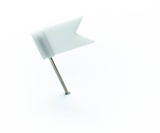 istock White flag shaped pushpin isolated on white background 2235787534